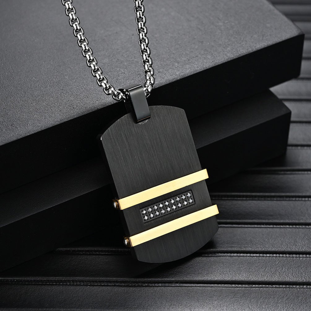 Men's Statement Necklace featuring a black pendant with gold accents and a stainless steel chain, perfect for bold style.