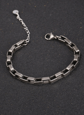 Stylish men's silver chain bracelet with clasp on a dark background.