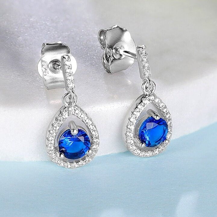 Wee Luxury Silver Earrings Silver Synthetic Sapphire Dangle Earrings Attract Light