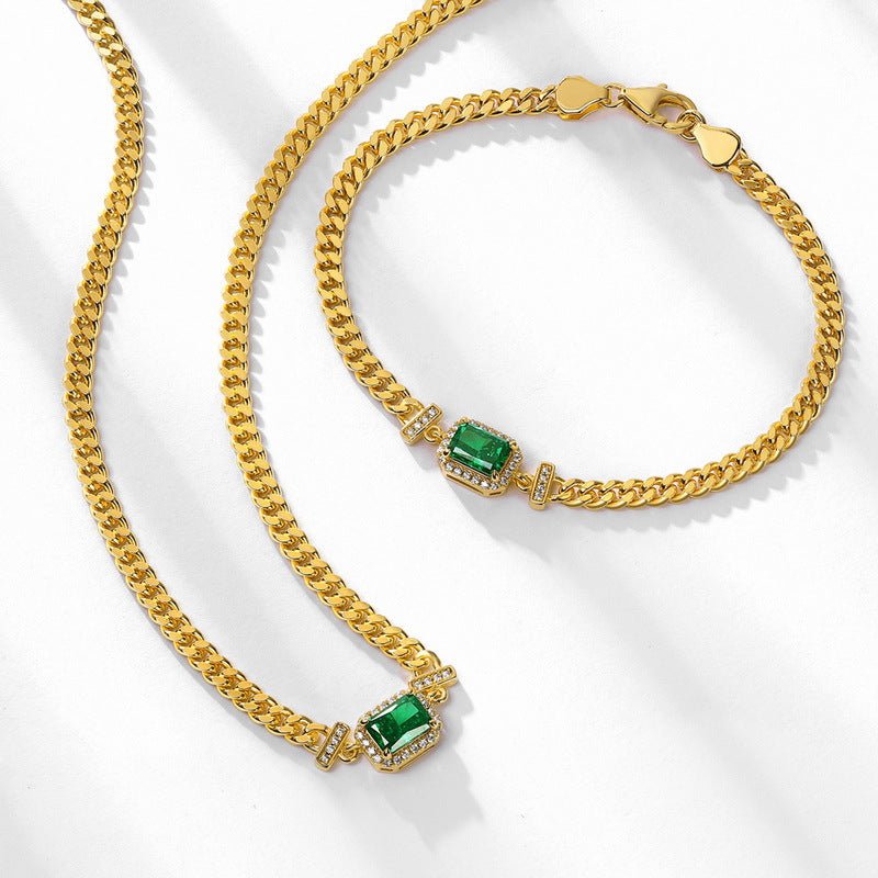 Handcrafted silver jewelry necklace with emerald accent, elegant and versatile design.