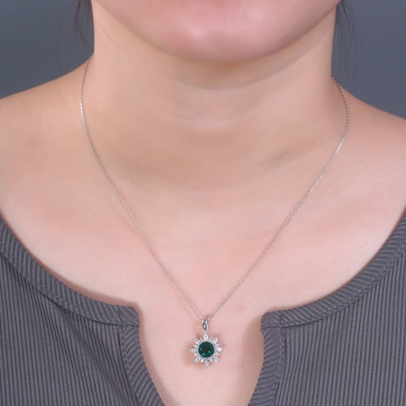 Gemstone pendant necklace on woman's neck, crafted from 925 silver, featuring a modern geometric design with round gemstone.