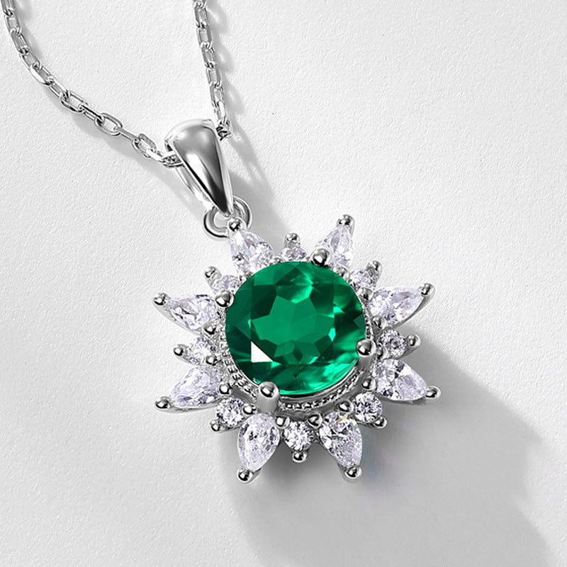 Exquisite gemstone silver jewelry with 925 silver and round emerald centerpiece.