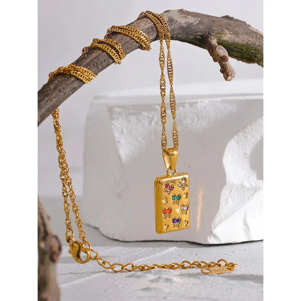 Gold plated butterfly pendant necklace with cubic zirconia on a delicate chain.